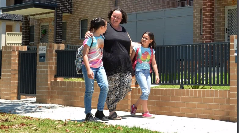 Mum walking with her kids