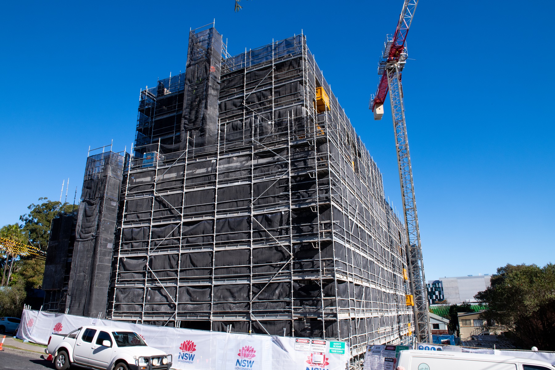 Photograph of LAHC's Beane Street Gosford development, with scaffolding and framing up.