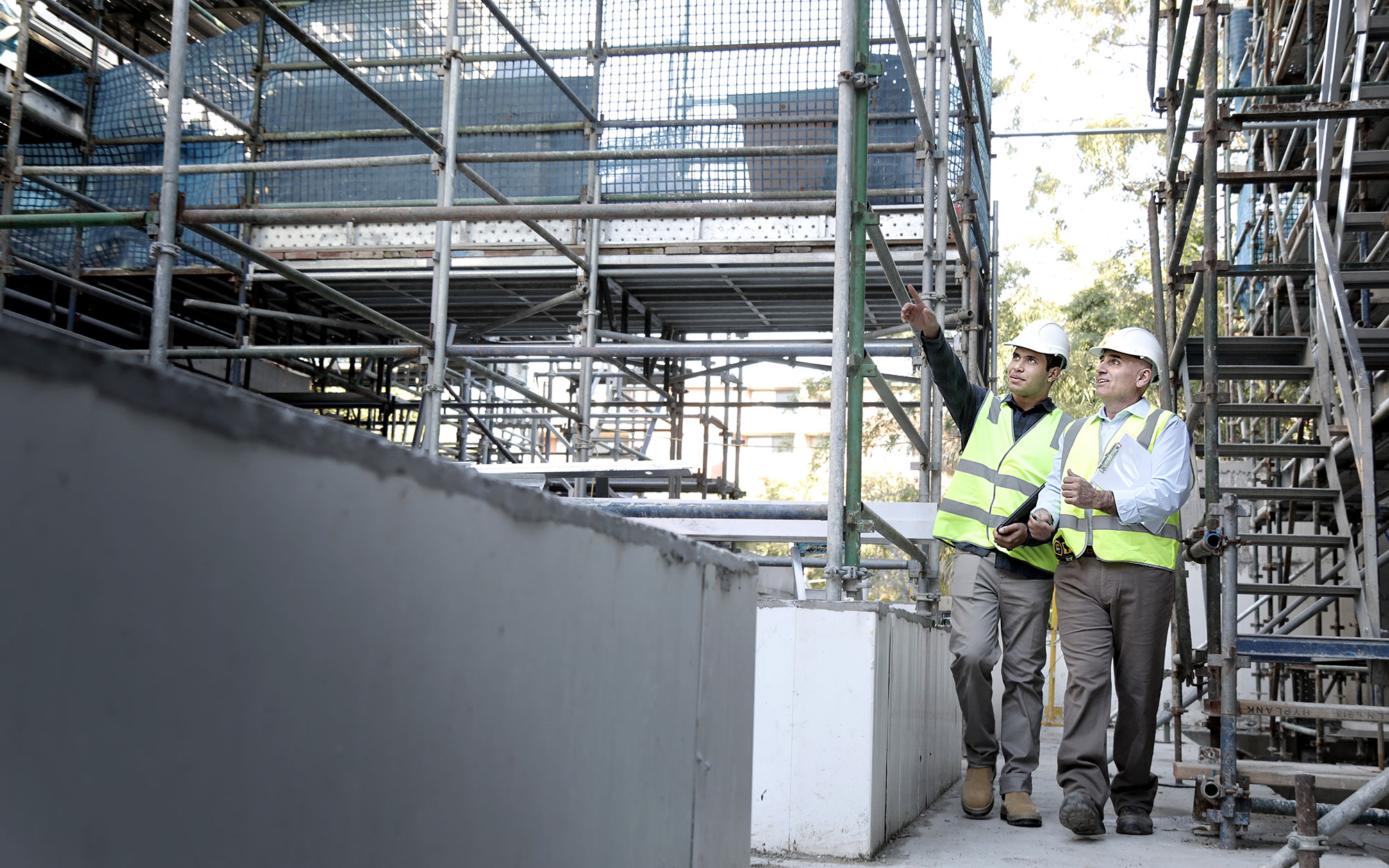 Two male building certifiers inspect a building site - Image credit:Christopher Walters 