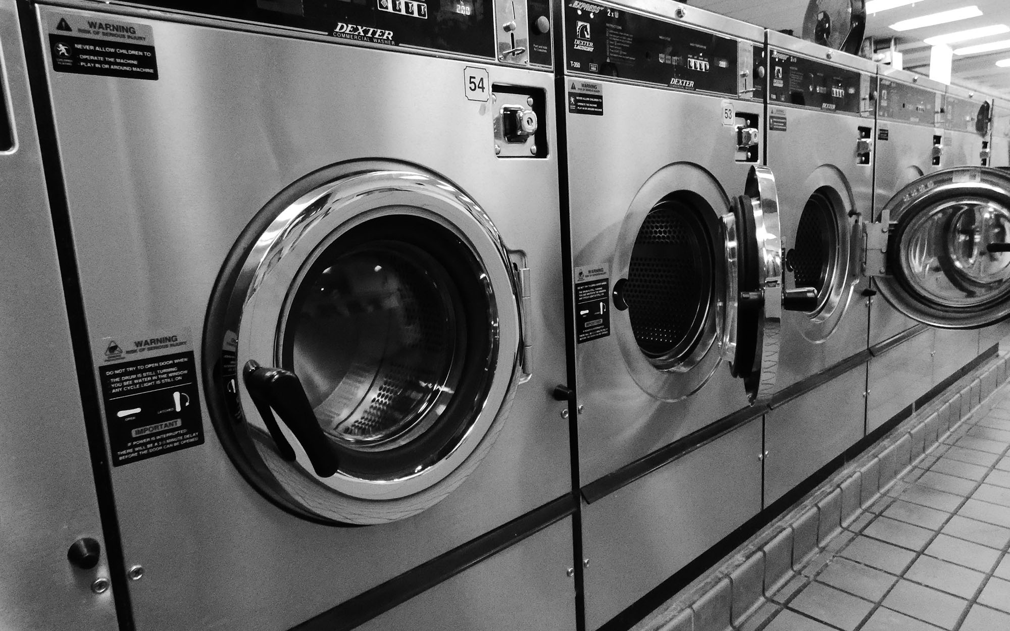 Washing machines in a commerical laundry - Image credit: Aaron Meacham