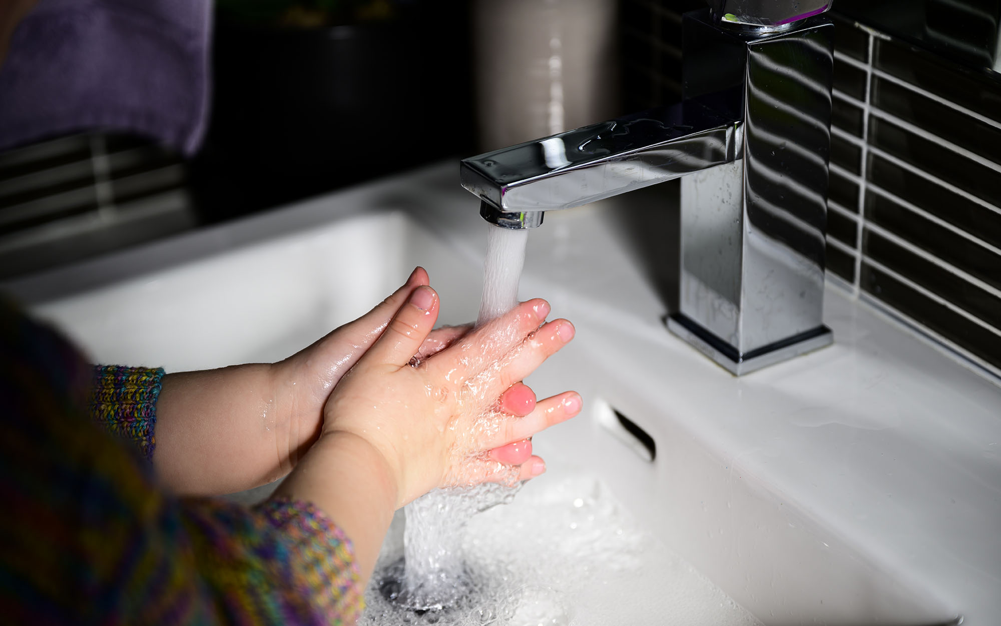 Girl washing hands - Image credit: Richard Bulley